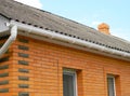 Asbestos roof with plastic rain gutter