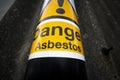 Asbestos warning sign on building