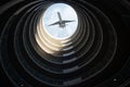 Ascending Aircraft Above the Spiraling Urban Architecture