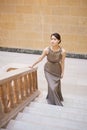 Ascending with poise. Portrait of an elegantly dressed young woman standing on a staircase. Royalty Free Stock Photo