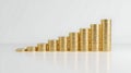 Ascending stacks of gold coins on a light gray surface Royalty Free Stock Photo