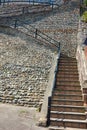Ascending stone steps on a cobble wall Royalty Free Stock Photo