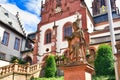 Aschaffenburg, Germany, Statue of theologian Adolph Franz in front of historic Catholic curch called `Kollegiatsstift`