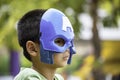 Asean boy blue mask Background green tree Royalty Free Stock Photo