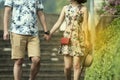 Asean couple in casual dress ,holding hand and walk outdoors,valentine concept