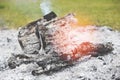 Ash bonfire campfire wood burning charcoal and smoke on outdoors