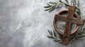 Ash Wednesday concept with cross, ashes, and olive leaves on concrete stone background