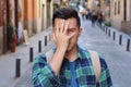 Ashamed man covering his face Royalty Free Stock Photo