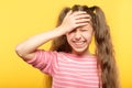 Ashamed smiling girl cover forehead hand embarrass Royalty Free Stock Photo