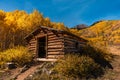 Pioneer Log Cabin in Colorado with Fall Colors Royalty Free Stock Photo