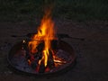 Ashes and burning wood in a fire bowl Royalty Free Stock Photo