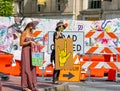 ASHEVILLE, NORTH CAROLINA, USA-June 1, 2021-Two young women protest peace and love in Pack Square Park in June 2021