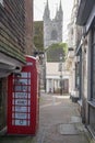 Ashford, Kent, United Kingdom - March 9, 2020: View from the High Street towards St Mary the Virgin church with phone box in