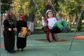 Ashgabad, Turkmenistan - October 9, 2014: Two women in Iranian c