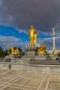 ASHGABAT, TURKMENISTAN - APRIL 17, 2018: Saparmurat Niyazov golden statue in Ashgabat, Turkmenist Royalty Free Stock Photo