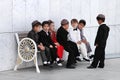 Ashgabat, Turkmenistan - May 25. Group of Asian children sittin