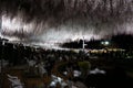 Ashikaga Flower Park. Hanging bunches of Wisteria tree, evening illumination. Many visitors to