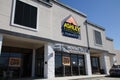 Ashley Furniture retail store exterior entrance sign and people