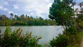 Ashtamudi lake in Kerala filled with green trees on shore. Kerala Backwaters Royalty Free Stock Photo