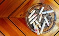 Ashtray and butted out cigarettes with lipstick Royalty Free Stock Photo