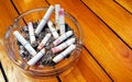 Ashtray and butted out cigarettes with lipstick Royalty Free Stock Photo