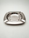 ashtray made of stainless steel on a white background Royalty Free Stock Photo