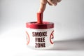 Ashtray with message, smoke free zone.