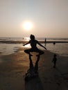 Ashvem beach yoga on sunset. Goa, India