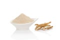 Ashwagandha powder in spoon with roots Royalty Free Stock Photo