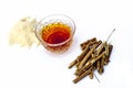 Ashwagandha with its powder isolated on white.