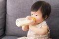 Asia baby girl feeding with milk bottle Royalty Free Stock Photo