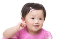 Asia baby girl hand touch her ear Royalty Free Stock Photo