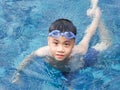 Asia boy kid child nine years old in swimming pool