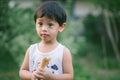 Asia boy he mouth aftertaste from eating chocolate ice cream or chocolate dessert. A sweet-toothed child eat chocolate. Kid with