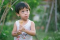 Asia boy he mouth aftertaste from eating chocolate ice cream or chocolate dessert. A sweet-toothed child eat chocolate. Kid with