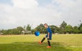 Asia boy playing Soccer football field stadium grass line ball b Royalty Free Stock Photo