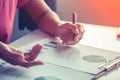 Asia business woman analyzing investment charts on desk. Royalty Free Stock Photo