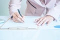 Asia business woman analyzing investment charts on desk. Royalty Free Stock Photo