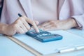 Asia business woman analyzing investment charts on desk. Royalty Free Stock Photo