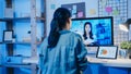 Asia businesswoman using desktop talk to colleagues about plan in video call meeting at living room. Working from house overload Royalty Free Stock Photo