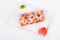 Asia. California rolls with salmon red fish on a white plate o