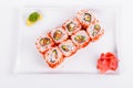 Asia. California rolls with salmon red fish on a white plate o