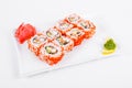 Asia. California rolls on a white plate on a white background