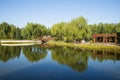 Asia China, Beijing, Guta Park, Lake view, wooden bridge, wooden pavilion