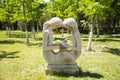 Asia China, Beijing, Yang Shan Park, landscape sculpture,Two girls reading