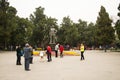 Asia China, Beijing, Zhongshan Park,Statues and garden flowers