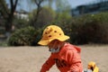 Asia Chinese little baby toddler boy child play sand at beach tool toy cars buckets and spades outdoor sunny happy carefree spring Royalty Free Stock Photo