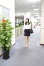 Asia Chinese office lady woman girl walk in office at work smile wear business occupation suit workplace Royalty Free Stock Photo