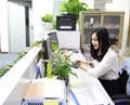Asia Chinese office lady woman girl at work smile look at computer laptop smart outfit wear business occupation suit workplace