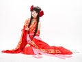 Asia Chinese style girl in red traditional dress dancer sit Royalty Free Stock Photo